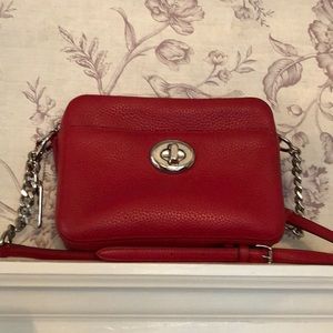 Red pebble leather coach crossbody bag